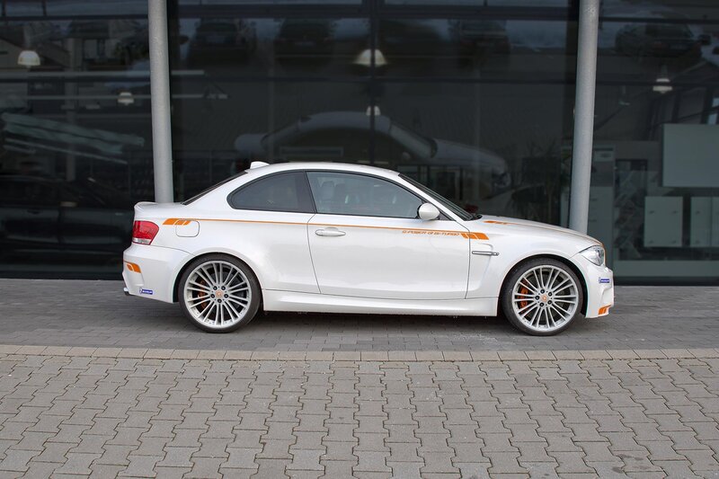 white bmw coupe with orange accents