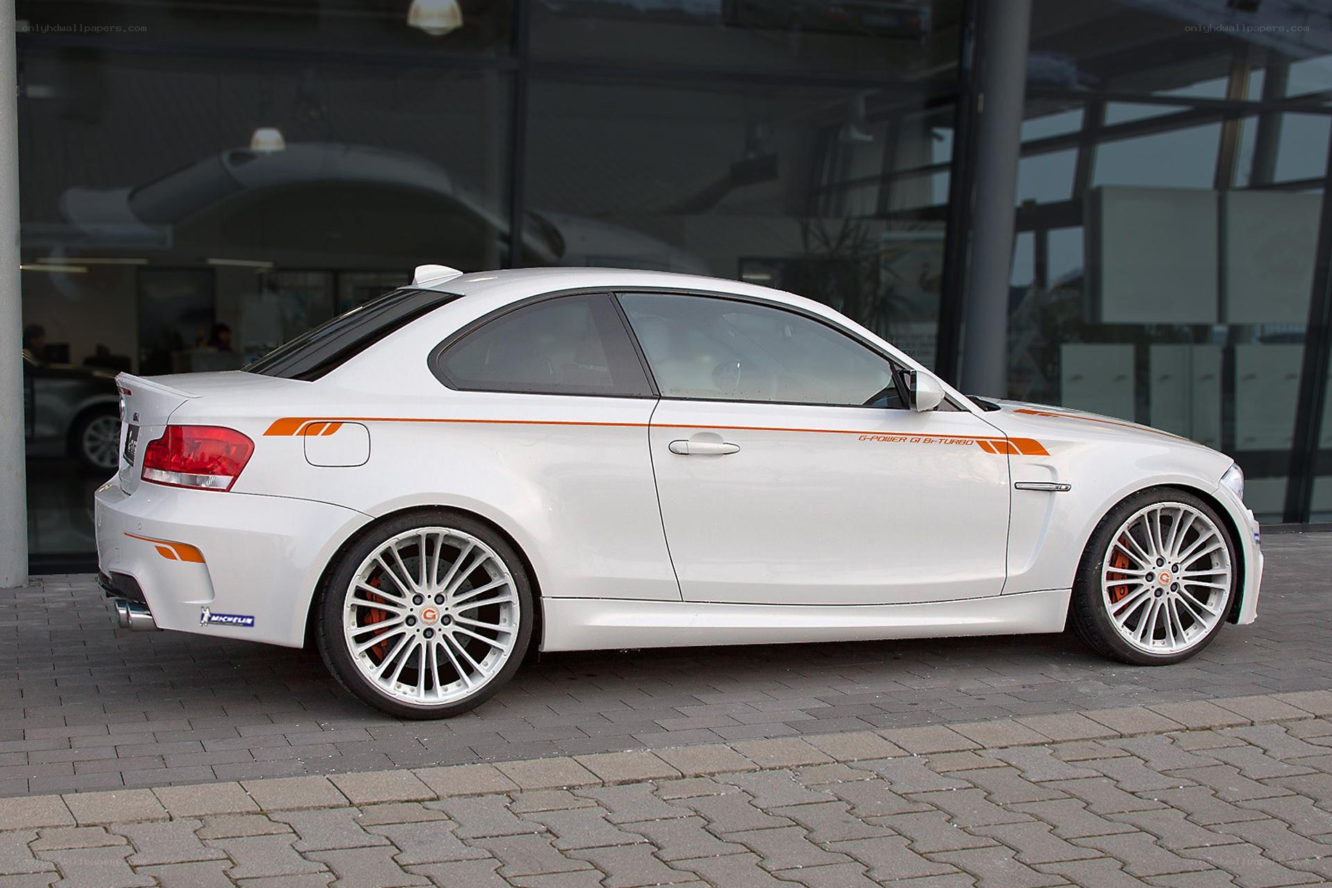 white bmw coupe with orange stripes