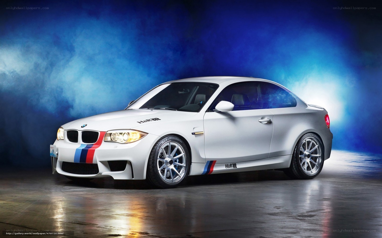 white bmw coupe with racing stripes