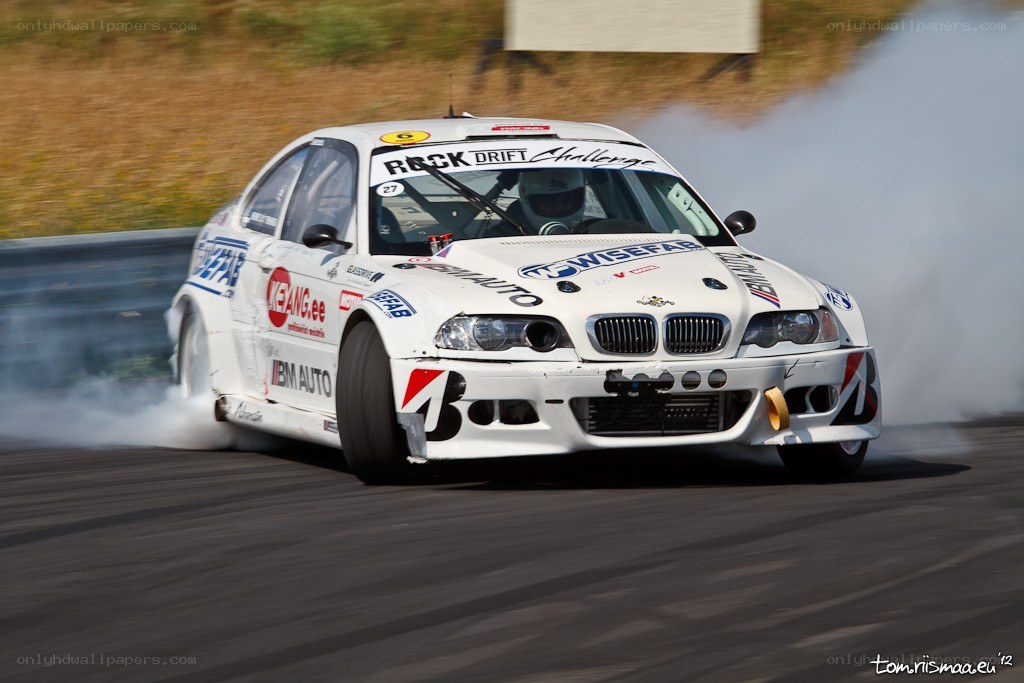 White BMW drifting on track