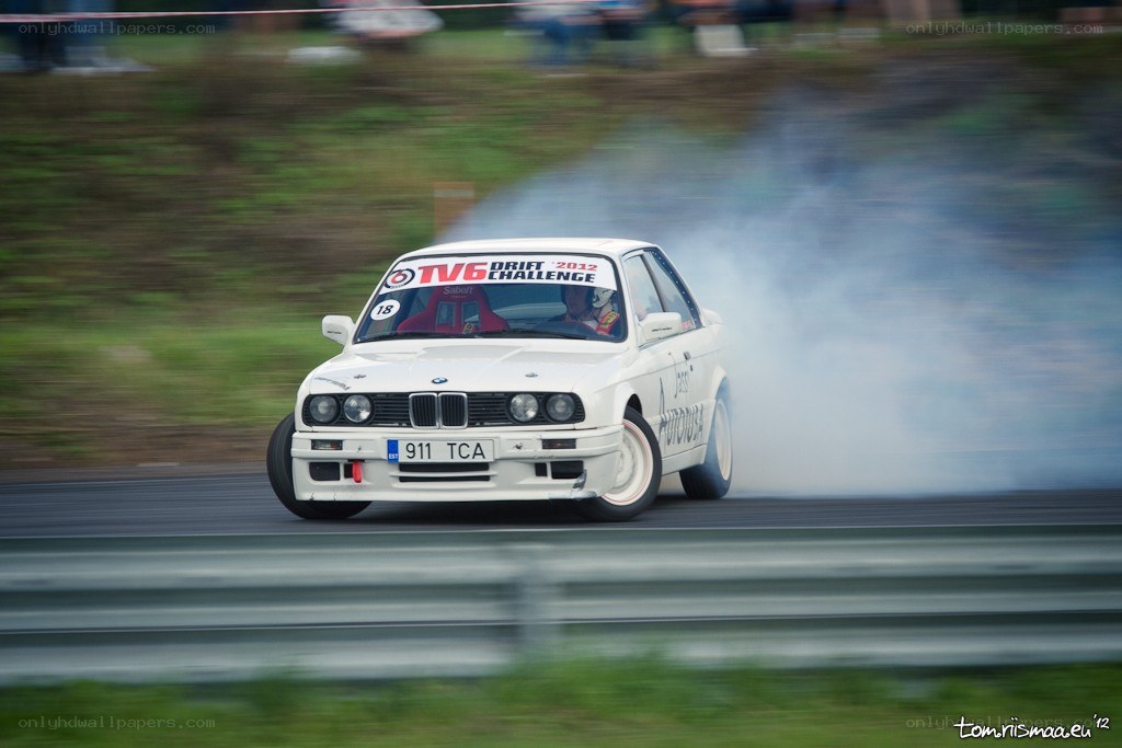 White BMW drifting on track