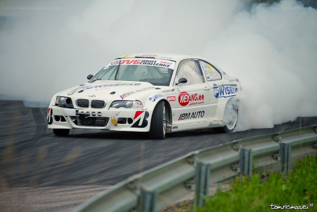 White BMW drifting on track