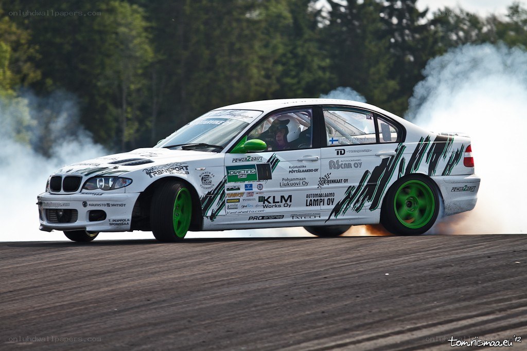 White BMW drifting on track