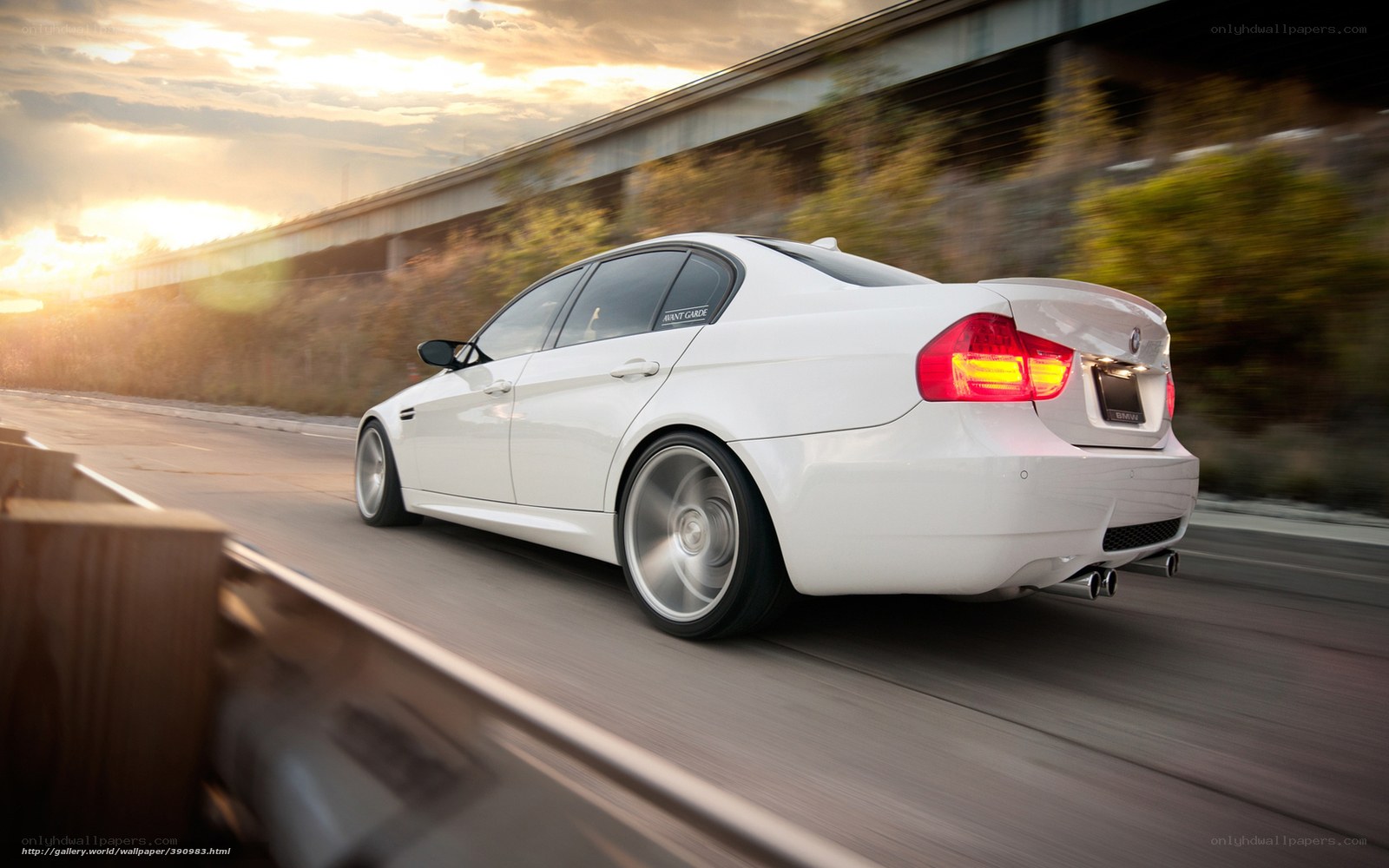 white bmw driving on road