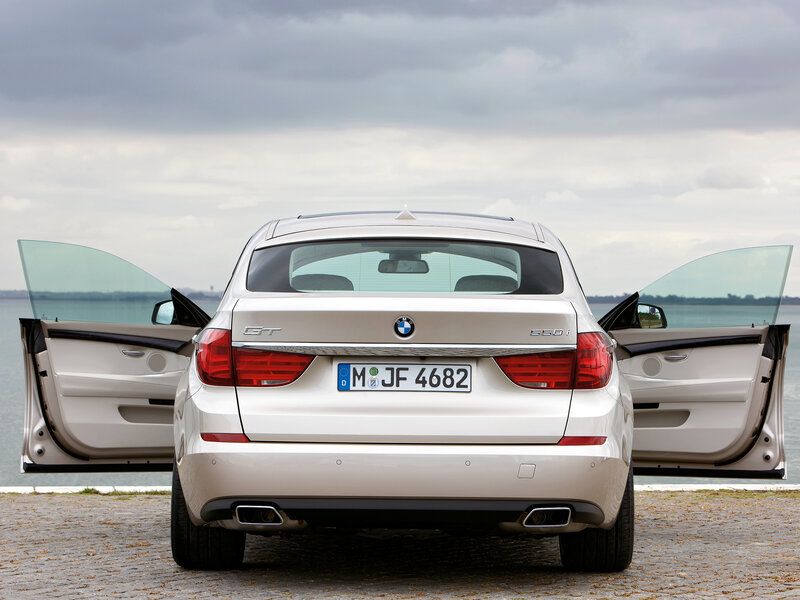 White BMW GT with open doors