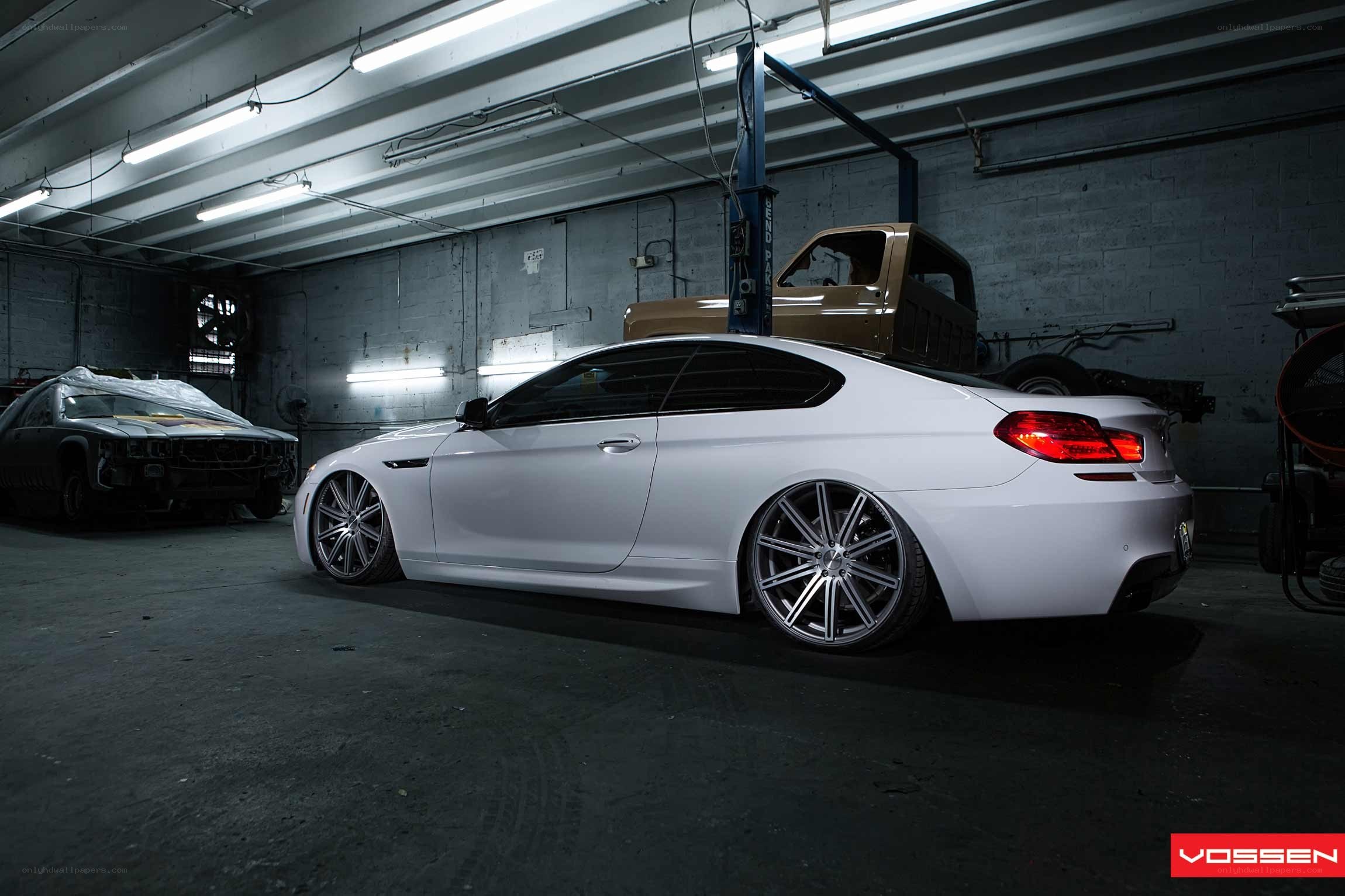 White BMW in a garage