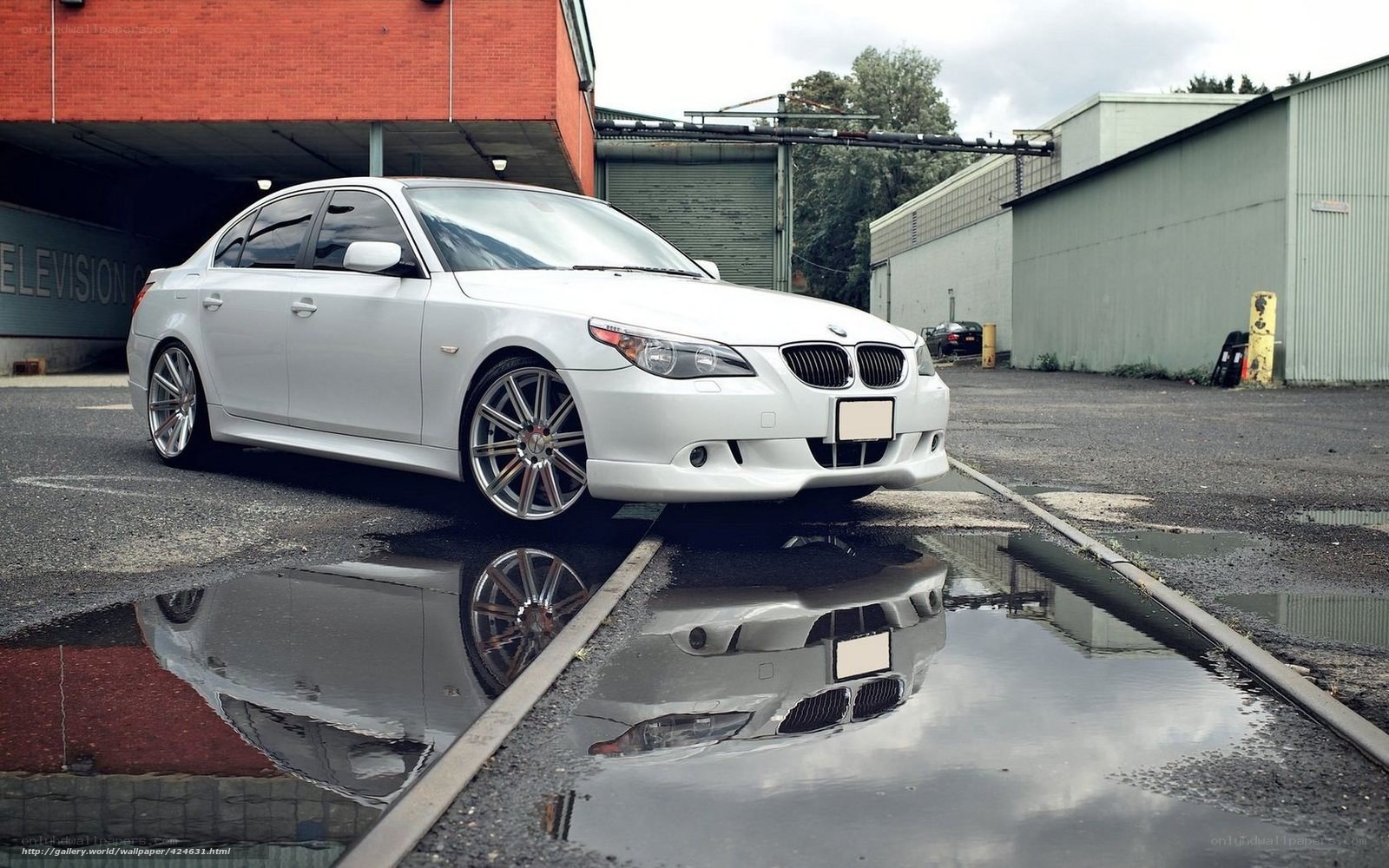 White BMW in a parking lot