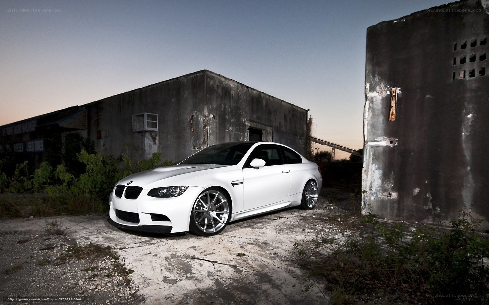 White BMW in an abandoned lot