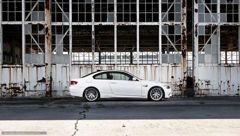 White BMW in an old hangar