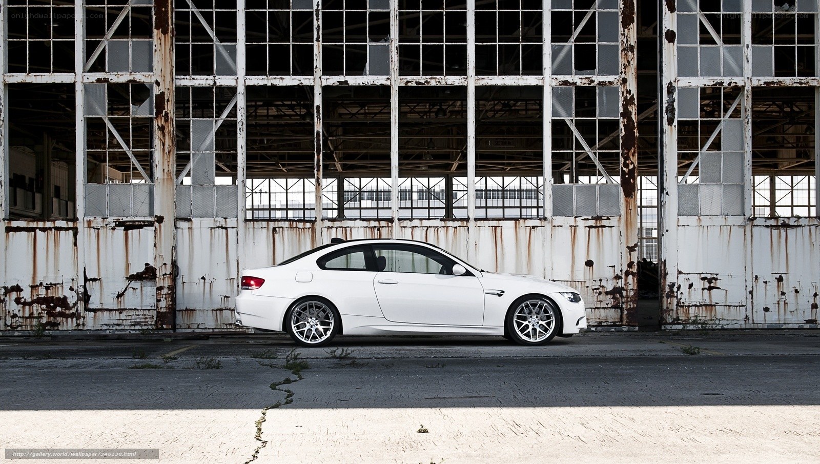 White BMW in an old hangar