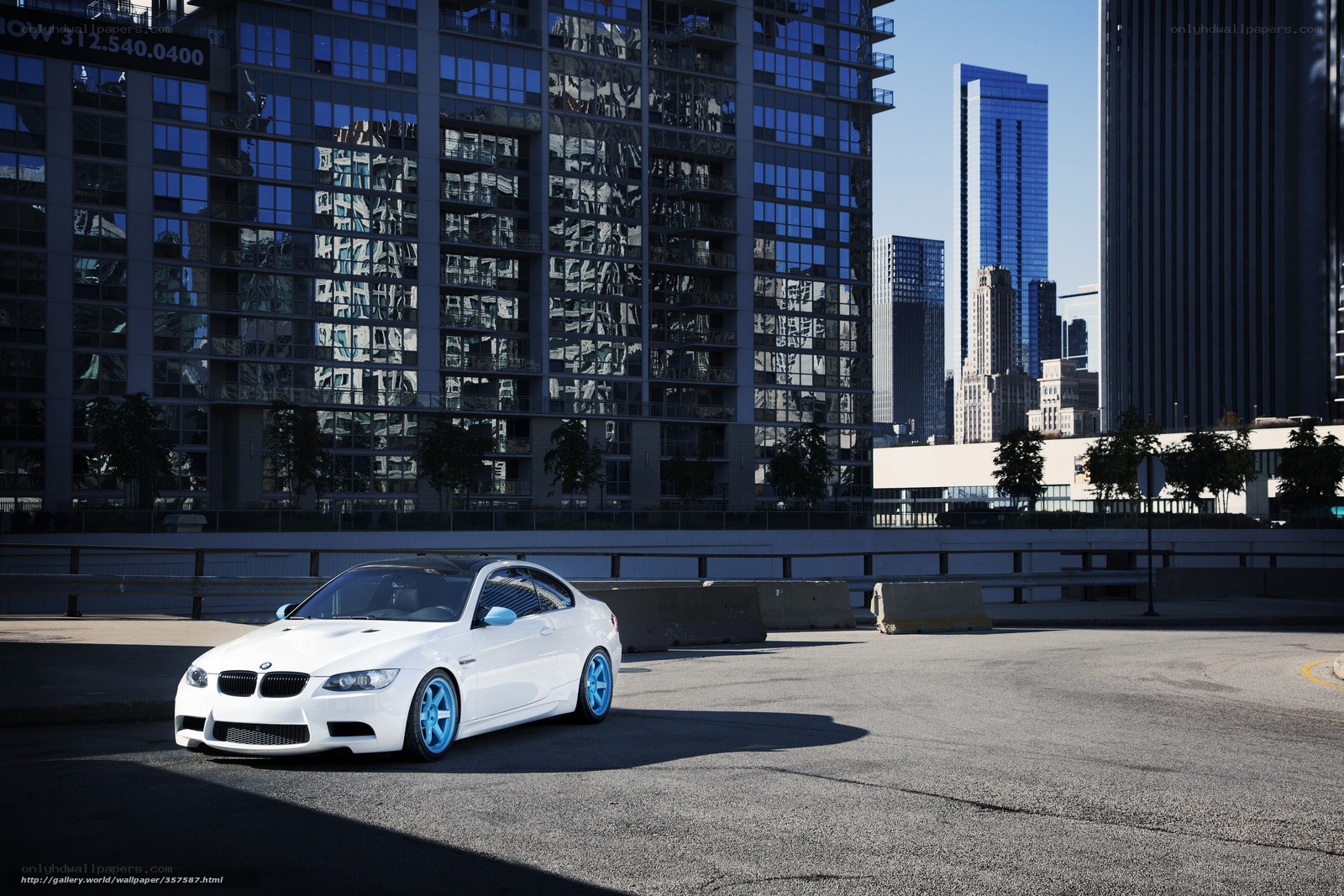 White BMW in city parking