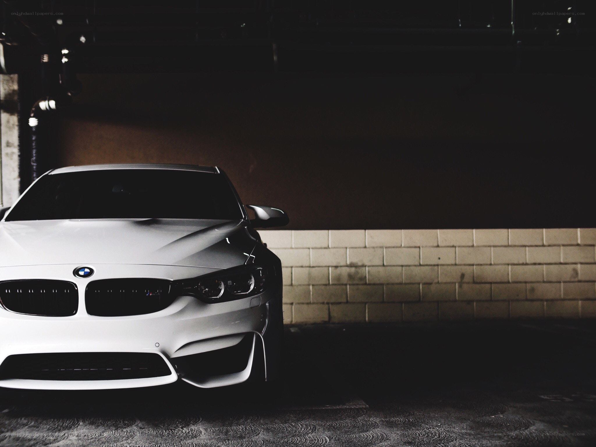 white bmw in dark garage
