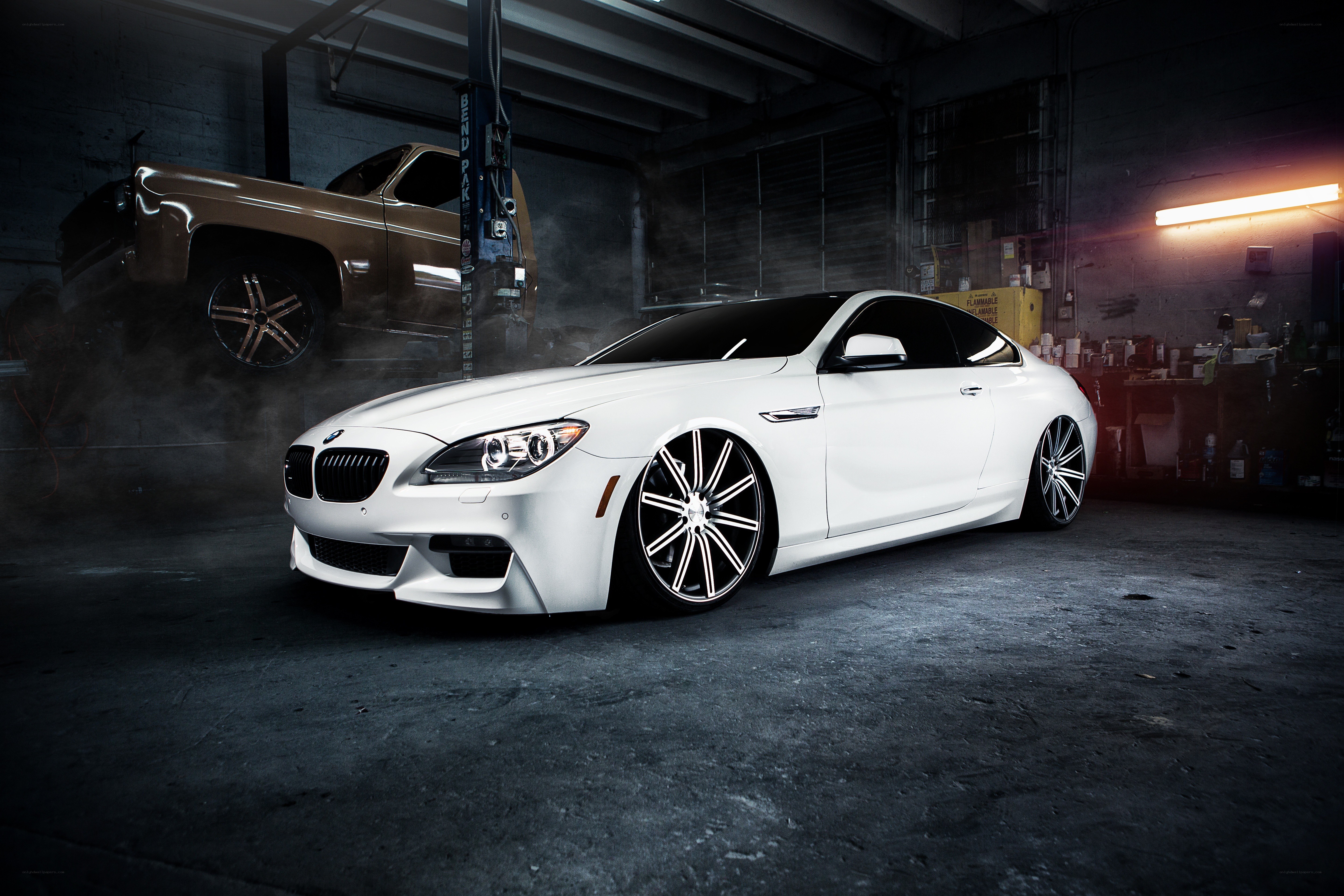 White BMW in garage