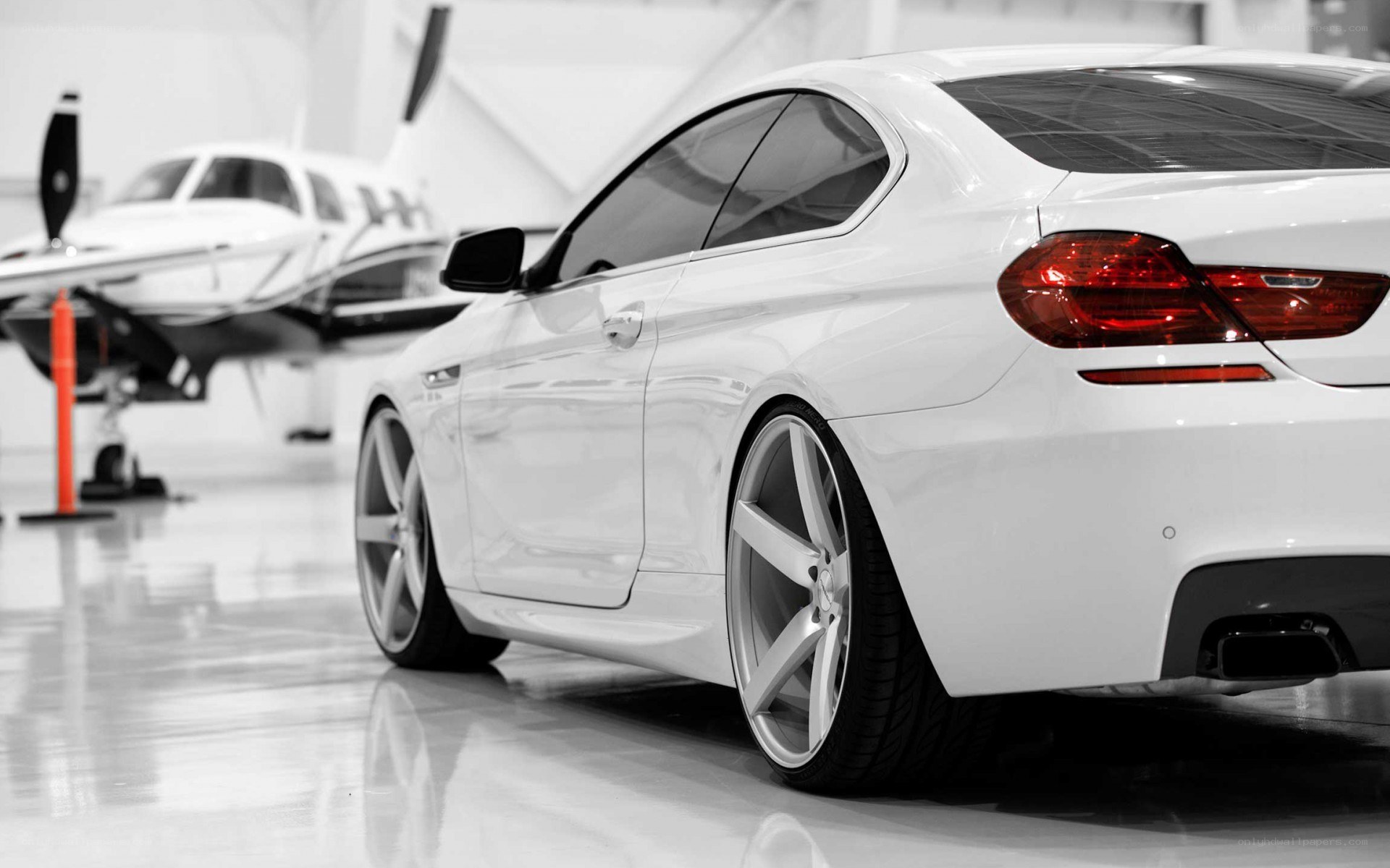 White BMW in hangar