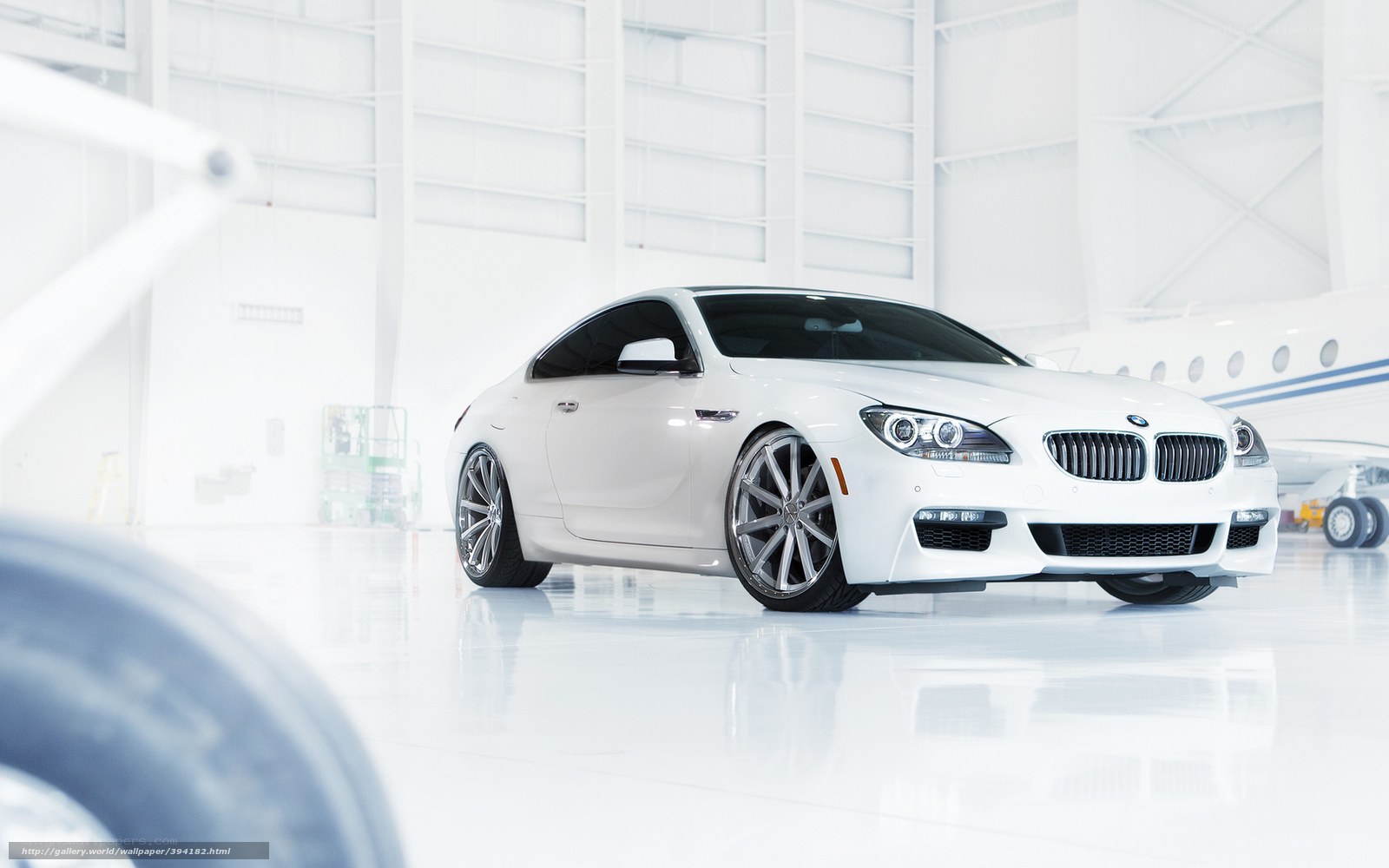 White BMW in hangar