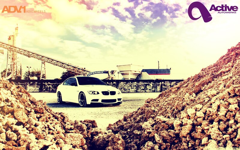 white bmw in industrial setting