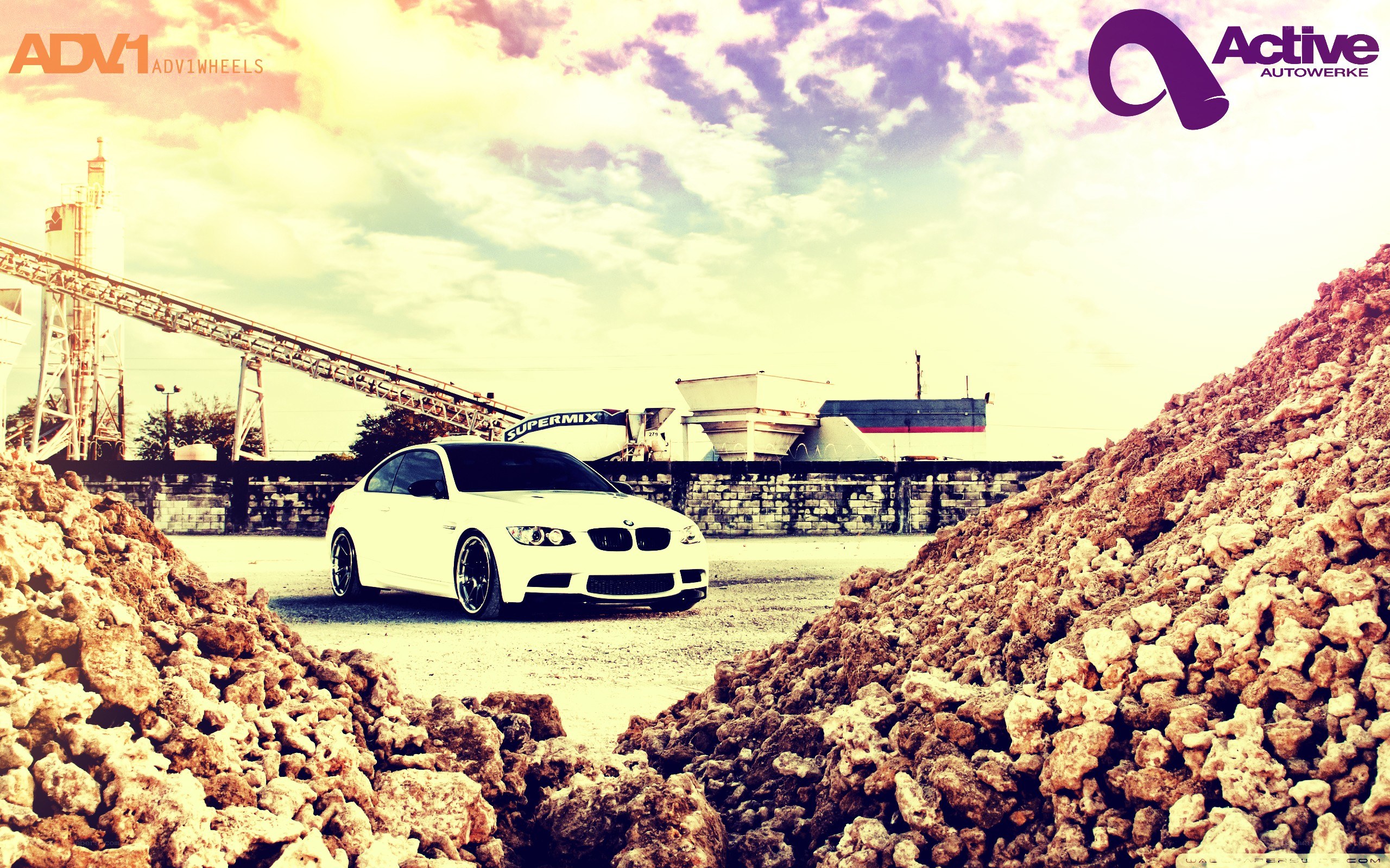 white bmw in industrial setting