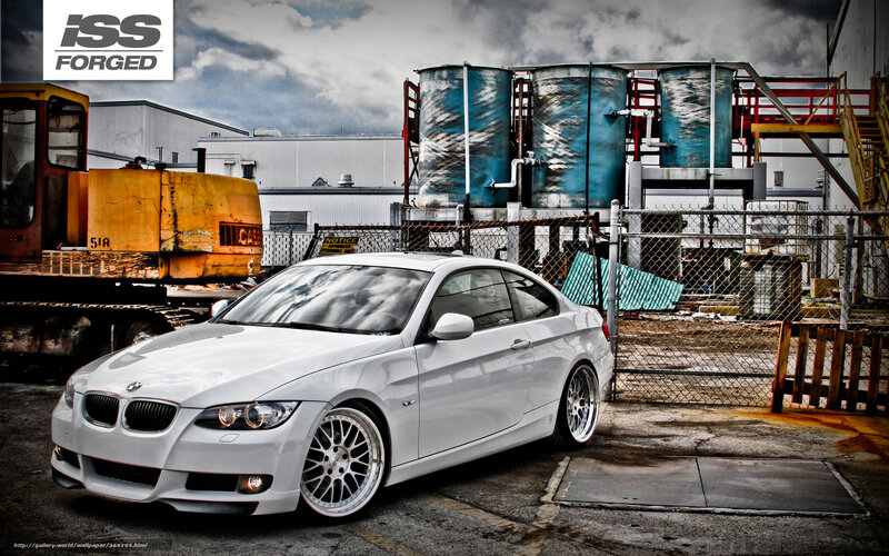 White BMW in industrial setting
