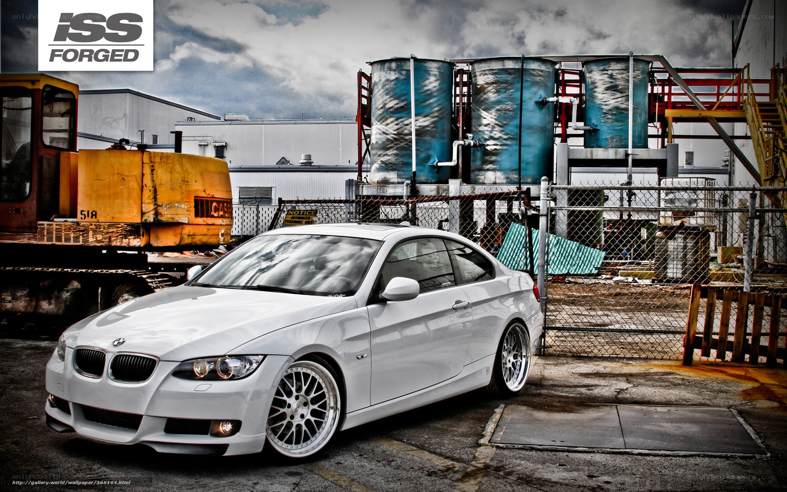 White BMW in industrial setting