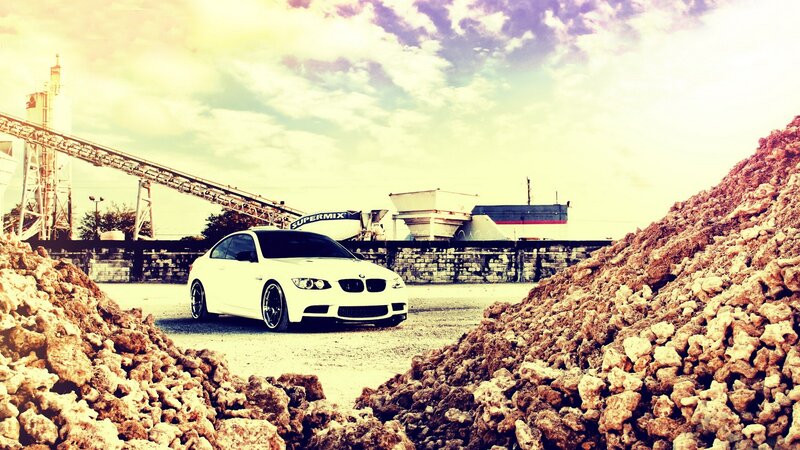 White BMW in industrial yard