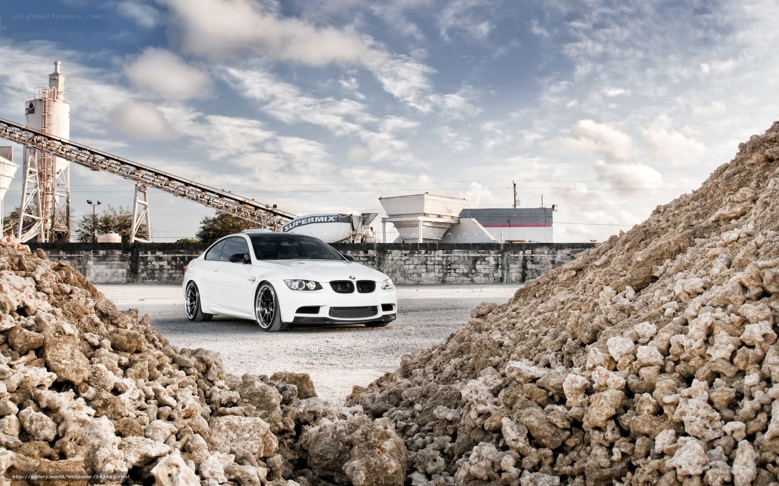 White BMW in industrial yard