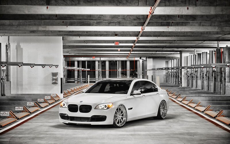 White BMW in parking garage