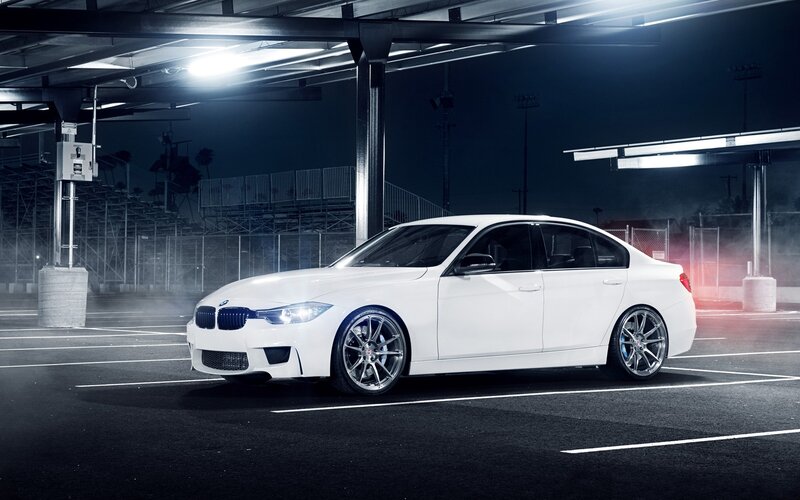 white bmw in parking garage