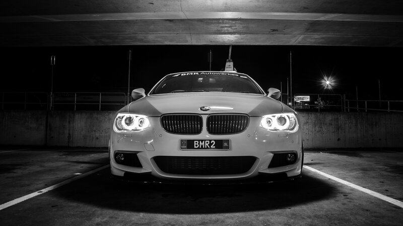 White BMW in parking garage