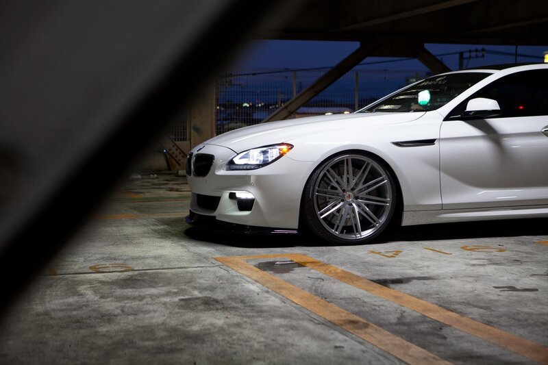 white bmw in parking garage