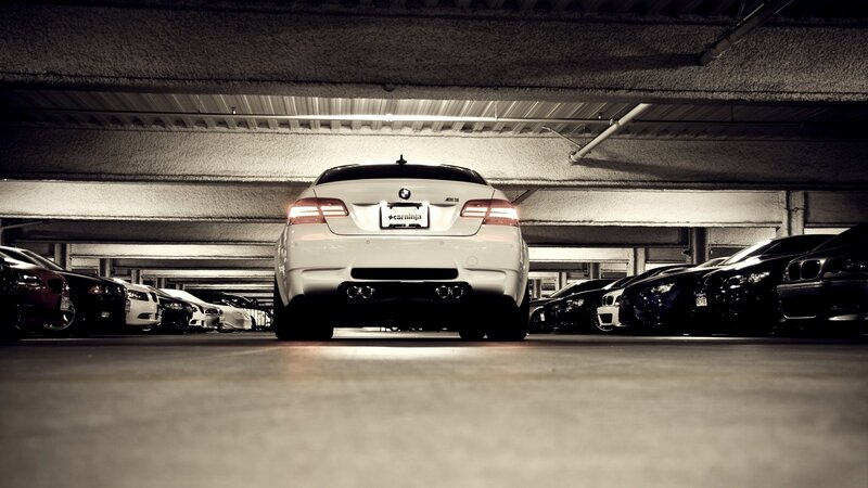 White BMW in parking garage