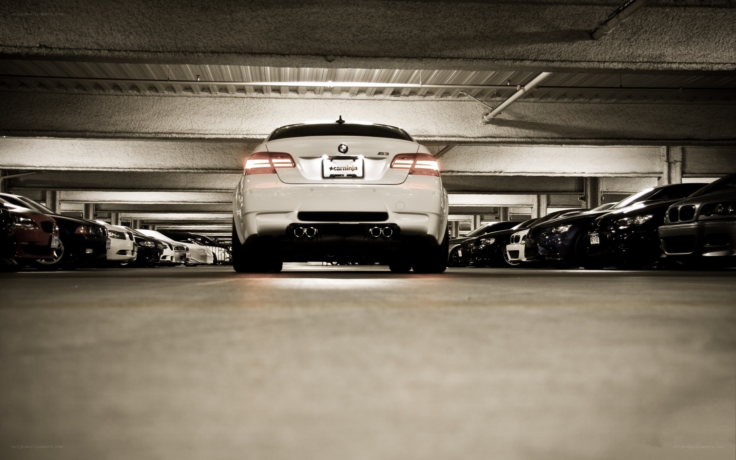 White BMW in parking garage