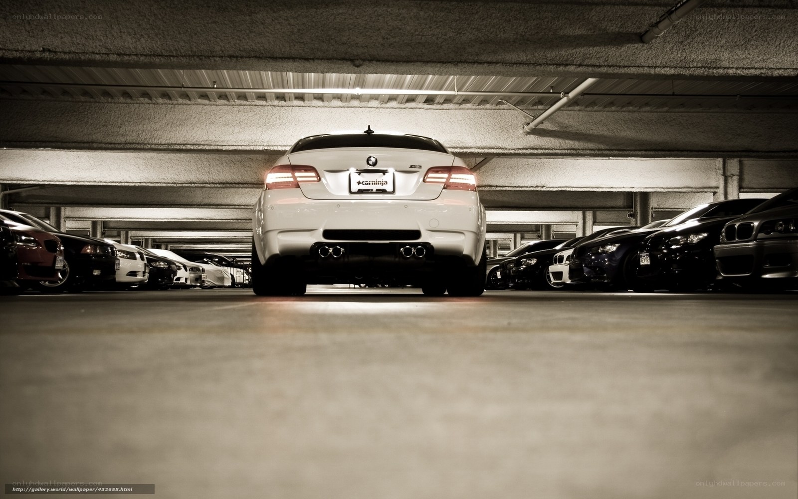 White BMW in parking garage