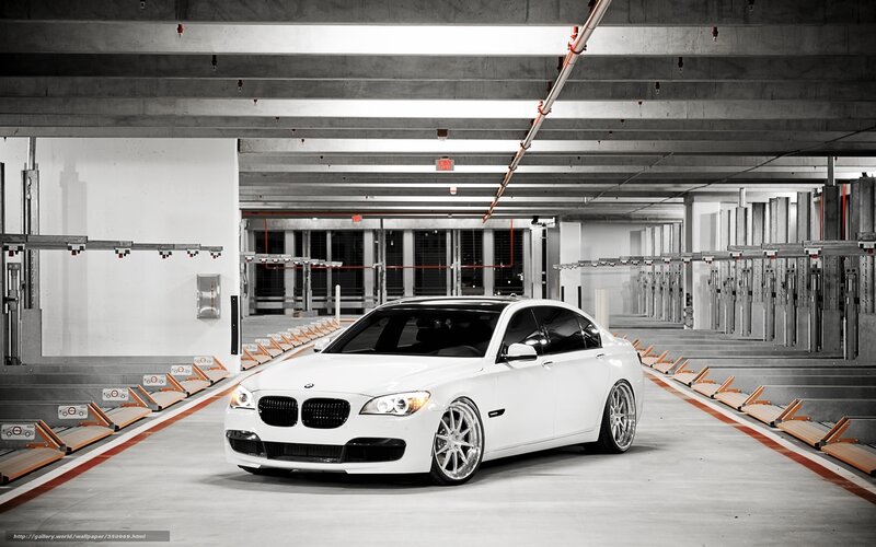 White BMW in parking garage