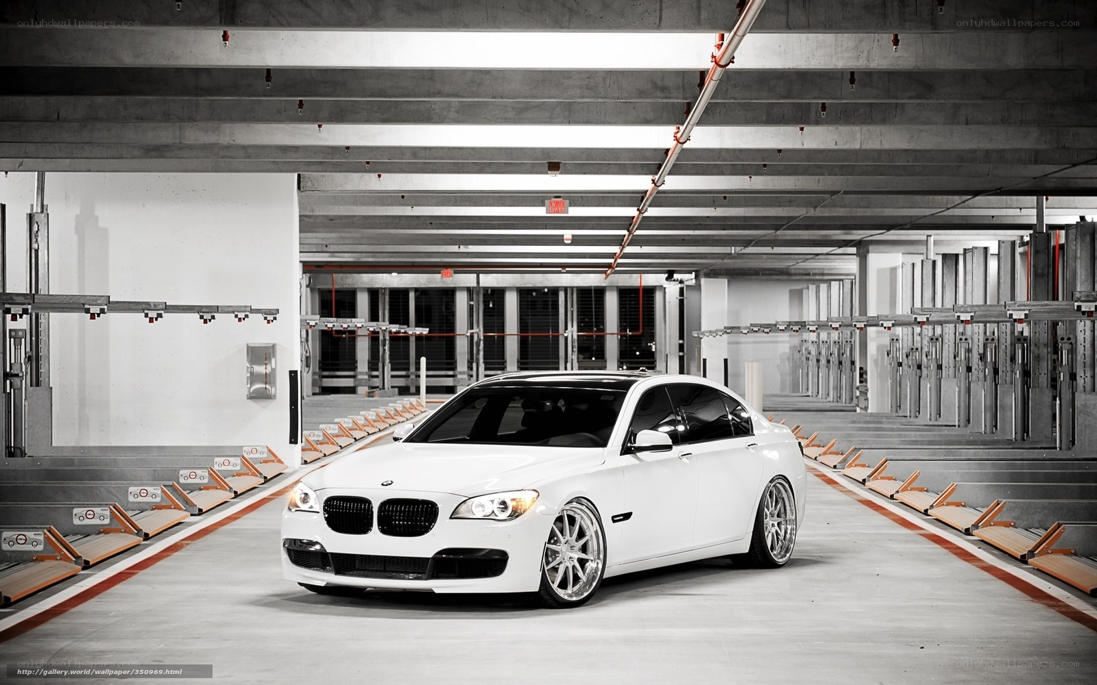 White BMW in parking garage