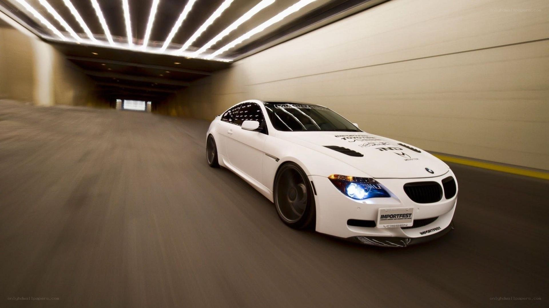 white bmw in tunnel