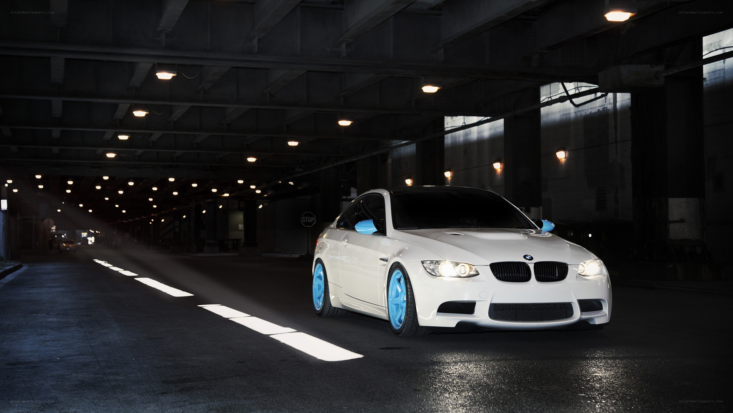 white bmw in underground tunnel