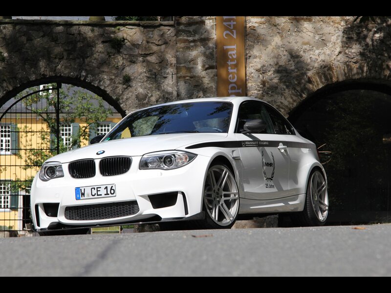 White BMW M135i at a stone archway