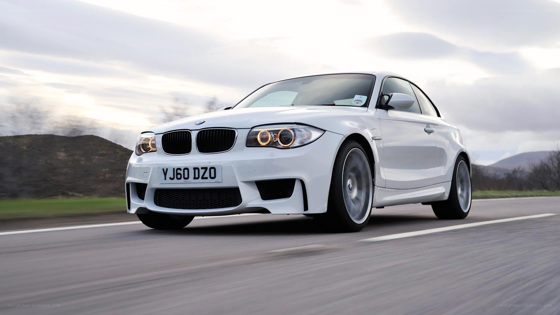 white bmw m135i on road