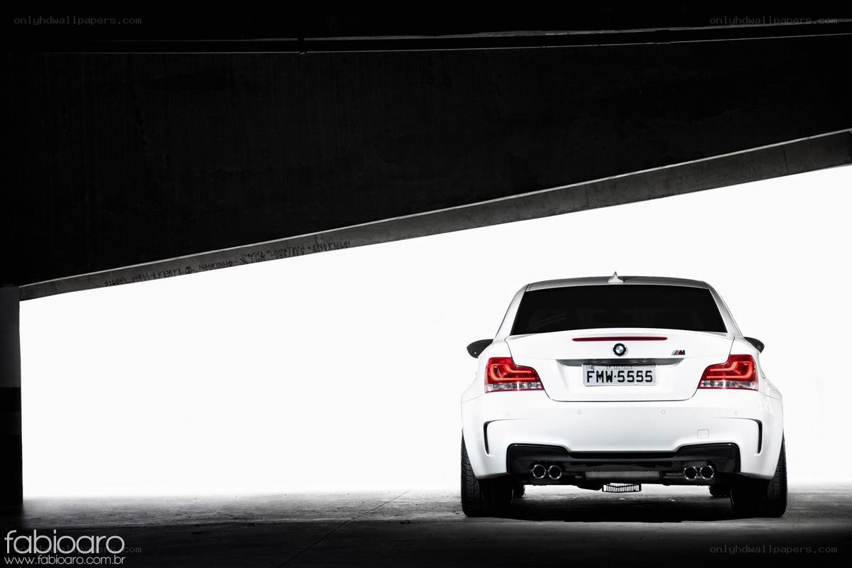 White BMW M135i under bridge