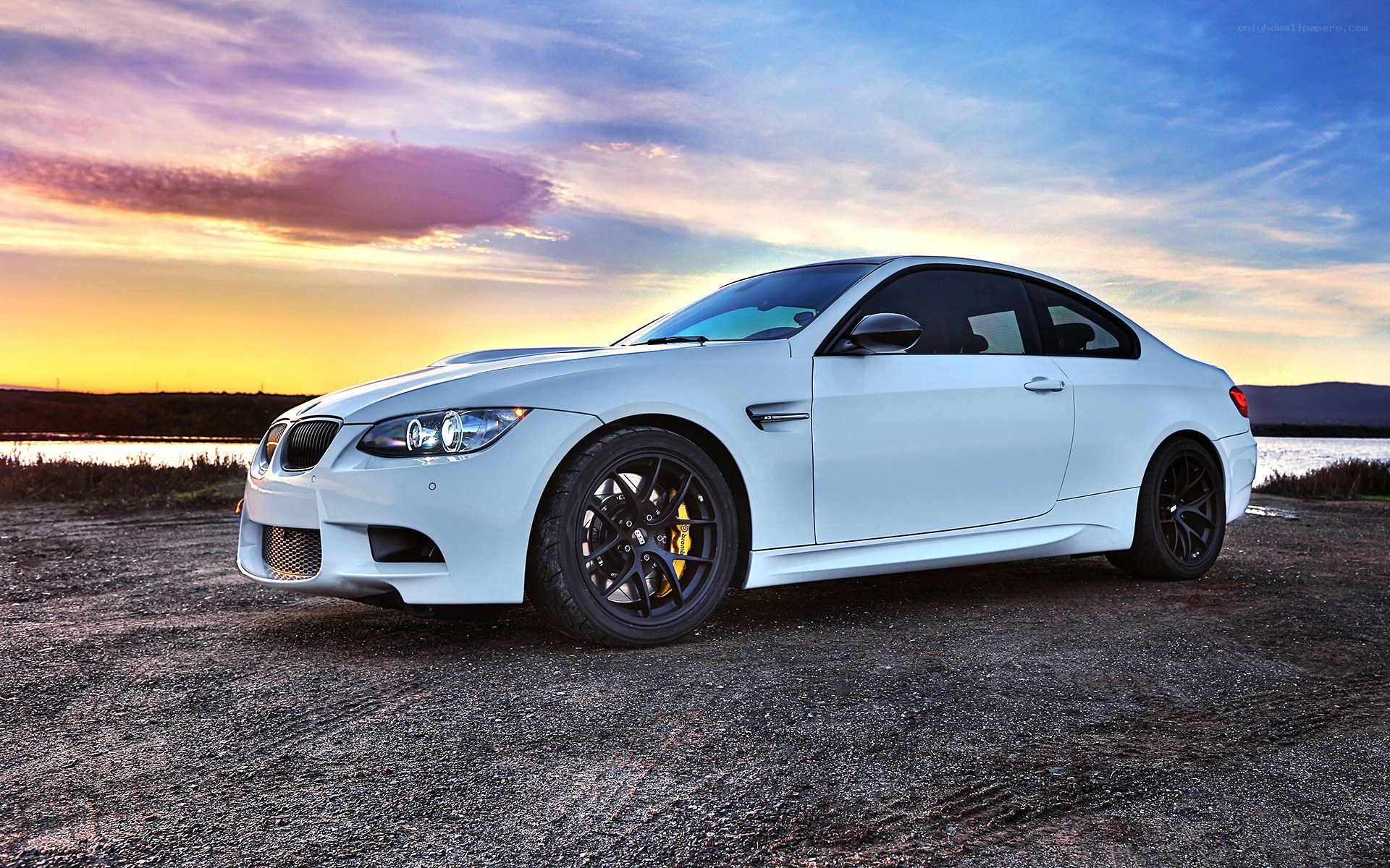 white bmw m3 at sunset