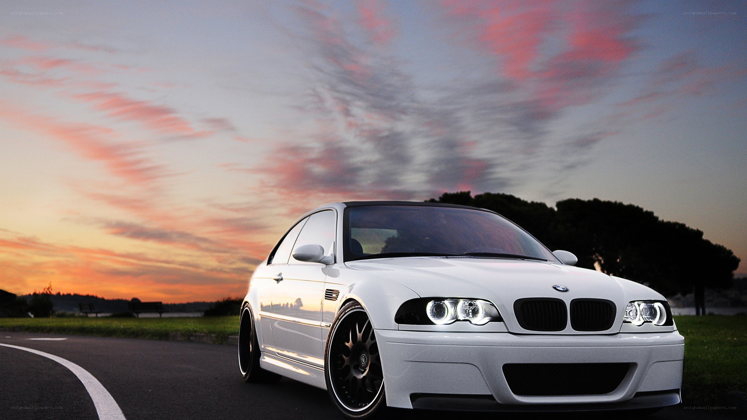 white bmw m3 at sunset