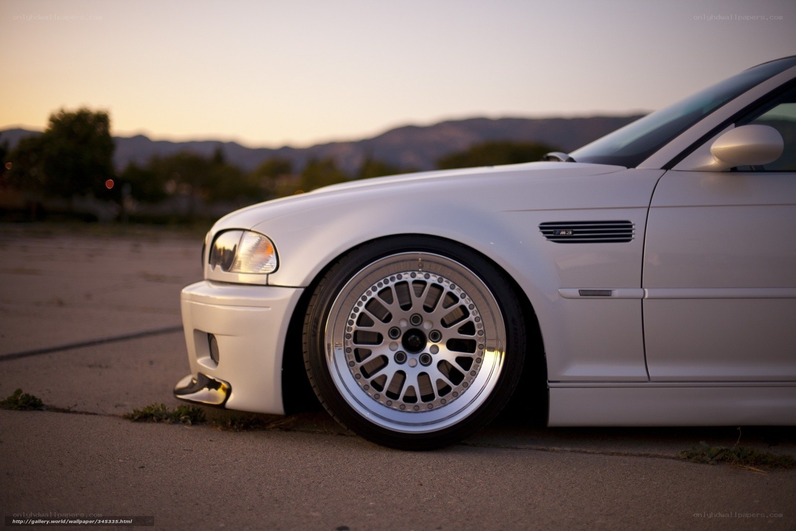 white bmw m3 at sunset