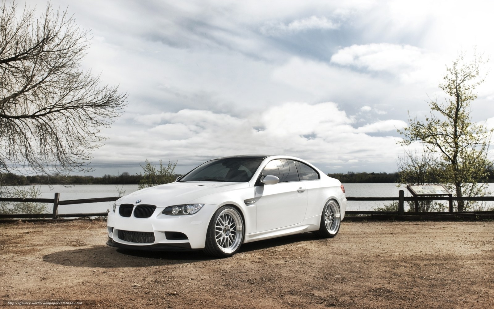 White BMW M3 by the lake