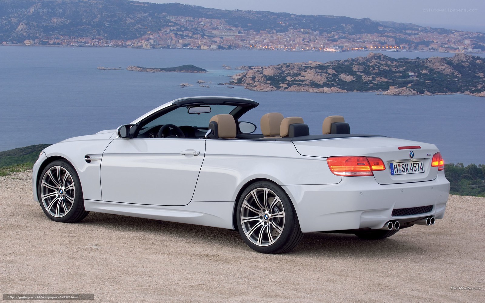 White BMW M3 convertible by the sea