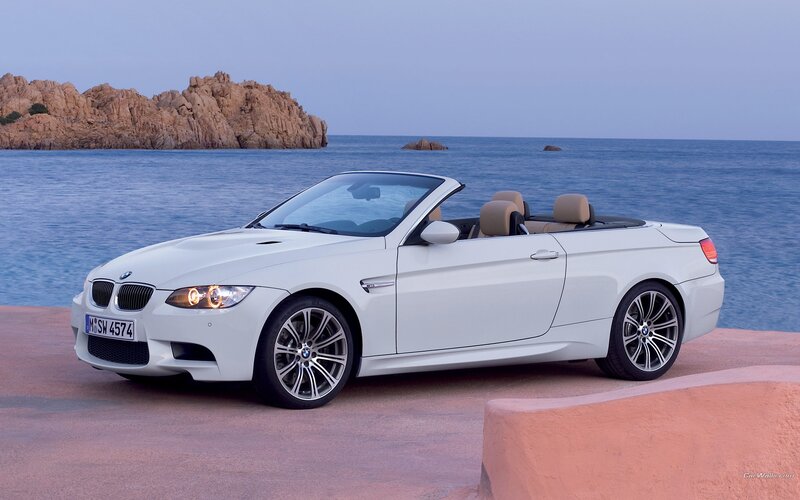white bmw m3 convertible by the sea