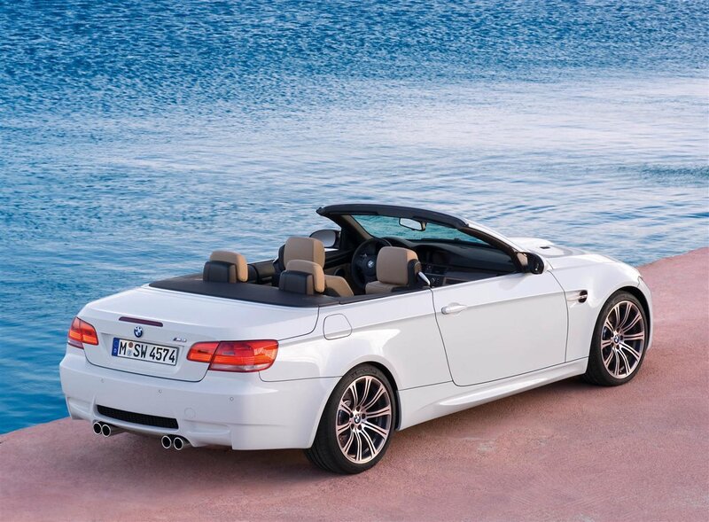 White BMW M3 convertible by the sea