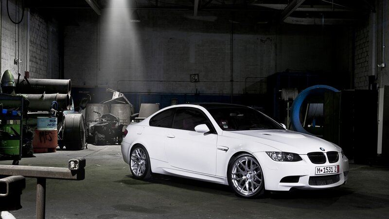 White BMW M3 in a warehouse
