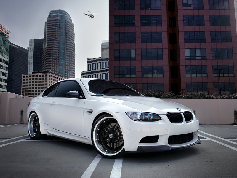 White BMW M3 in city parking