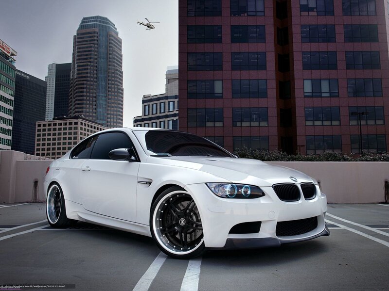 White BMW M3 in city parking