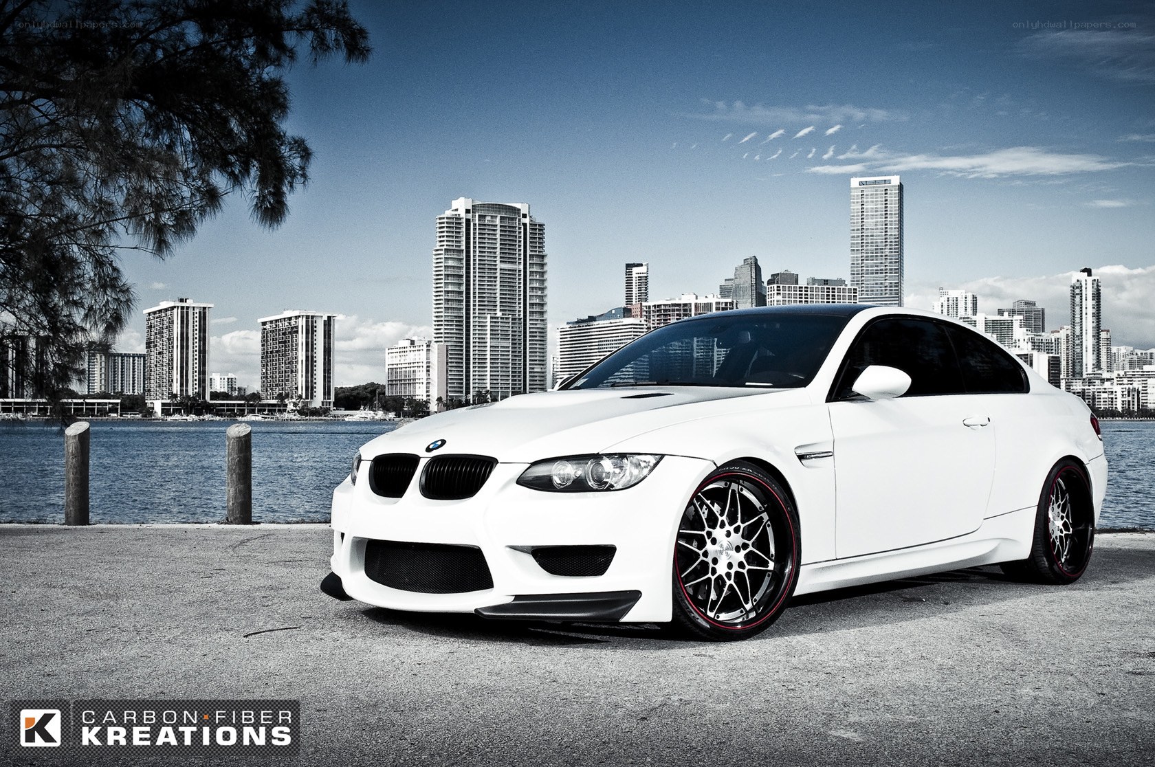 White BMW M3 in cityscape
